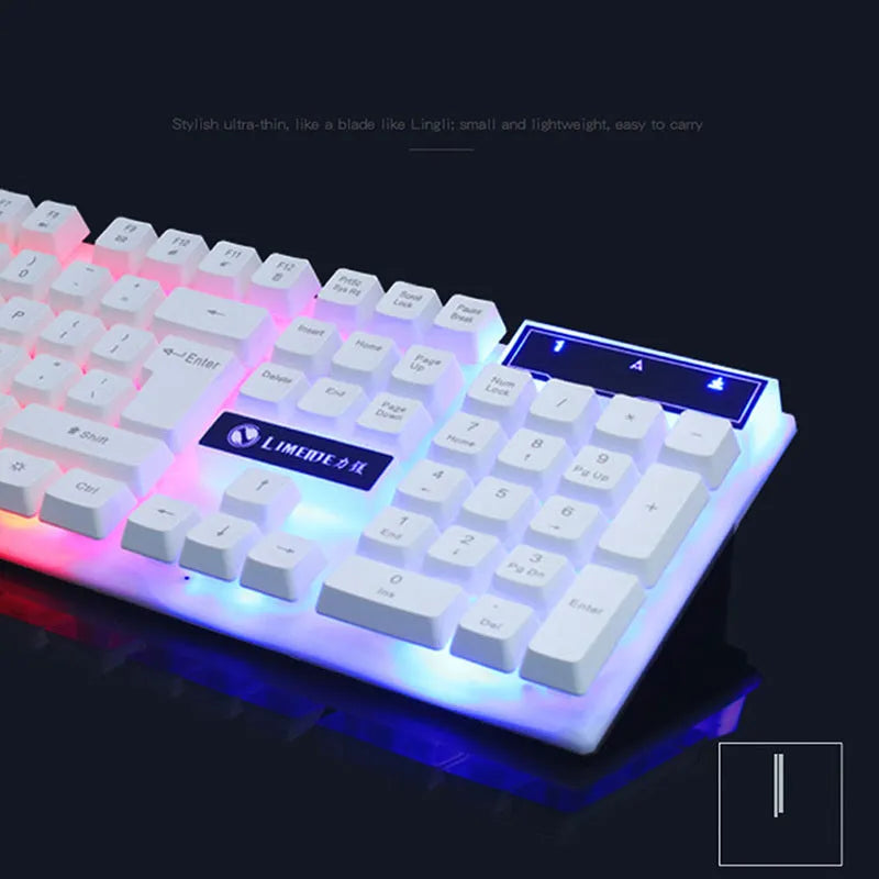 GTX300 black and white wired gaming keyboard and mouse set with colourful backlit keys on desk.