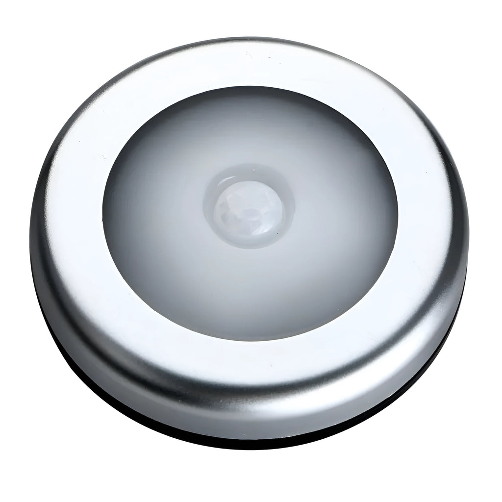 Silver wireless motion sensor night light with a square 80mm design on a table.