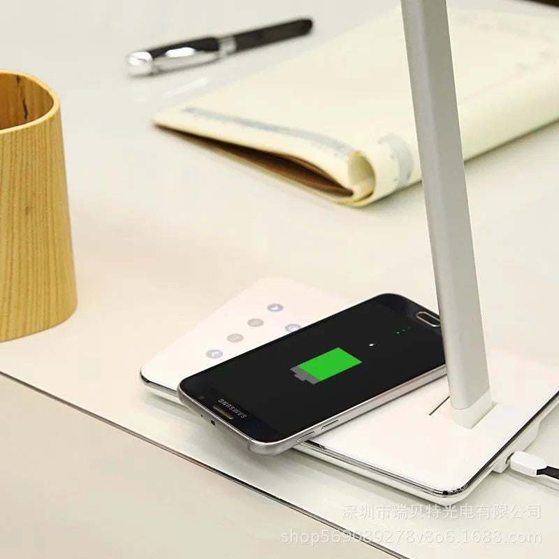 Black and white wireless charging desk lamp with touch controls and USB connection
