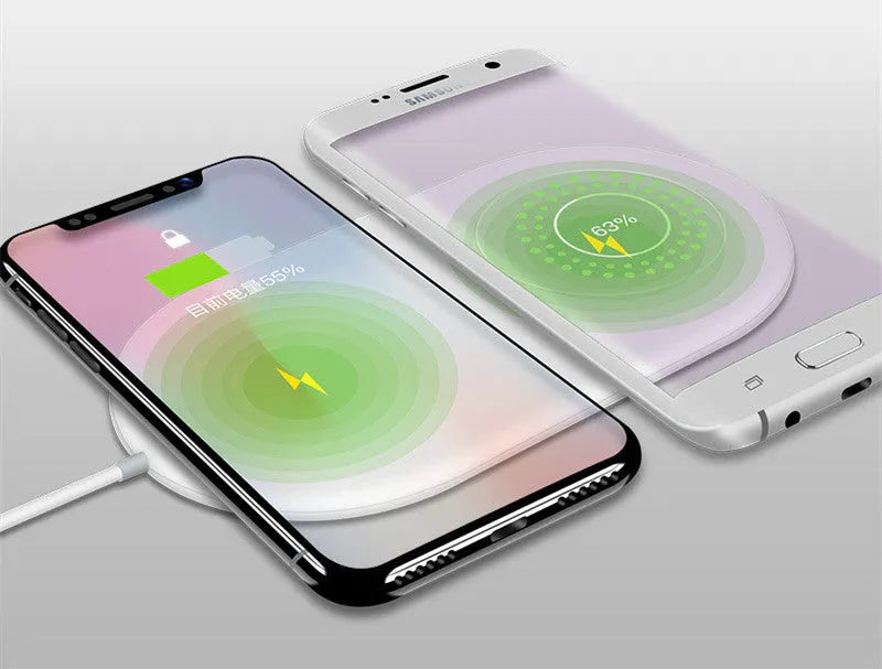White dual mobile phone wireless charger showing two phones charging simultaneously