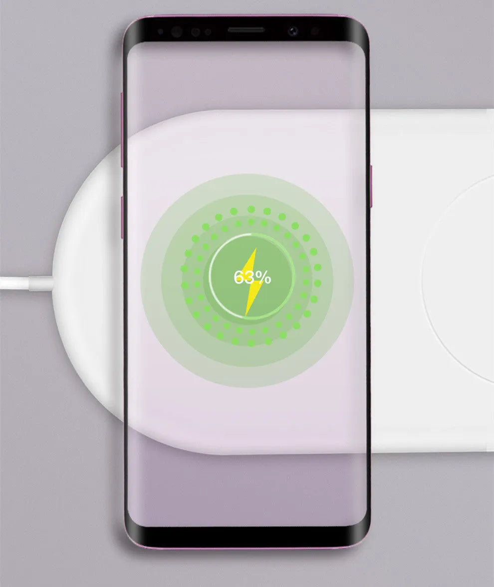 White dual mobile phone wireless charger showing two phones charging simultaneously