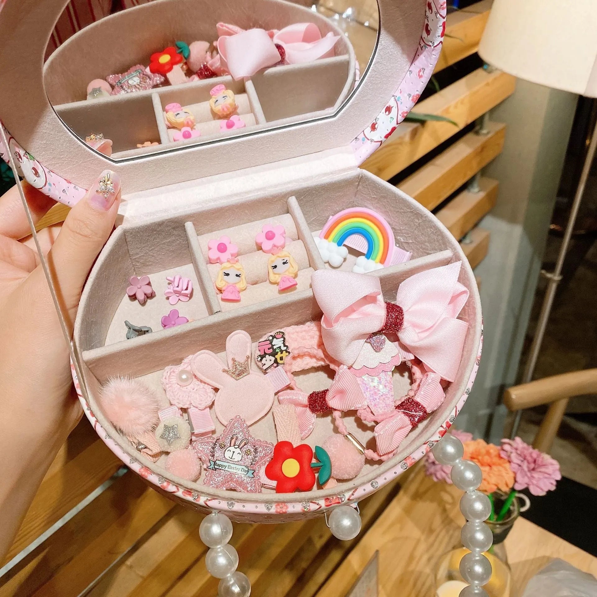 Children's princess headdress and hair clip set with 26 pieces in storage box, showing cartoon character designs