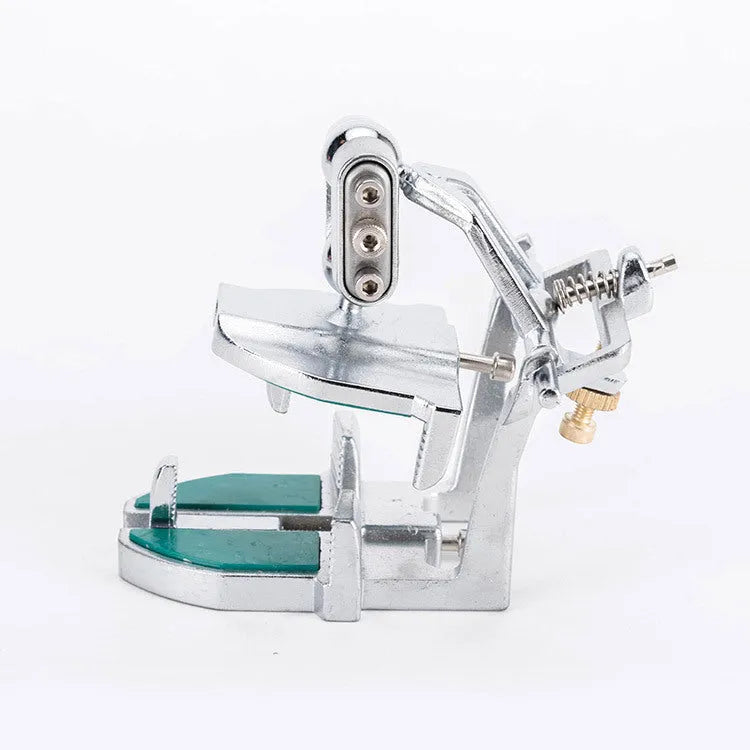 Korean dental articulator with adjustable upper and lower cast holders and two articulated joints.