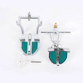 Korean dental articulator with adjustable upper and lower cast holders and two articulated joints.