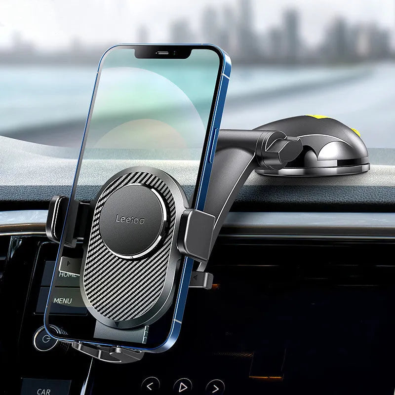 Folding suction cup mobile phone car holder in carbon fiber black on a car dashboard