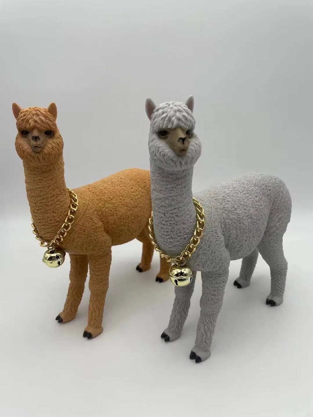 Portable Bluetooth speaker shaped like a brown alpaca with wood base, FM radio, and lanyard
