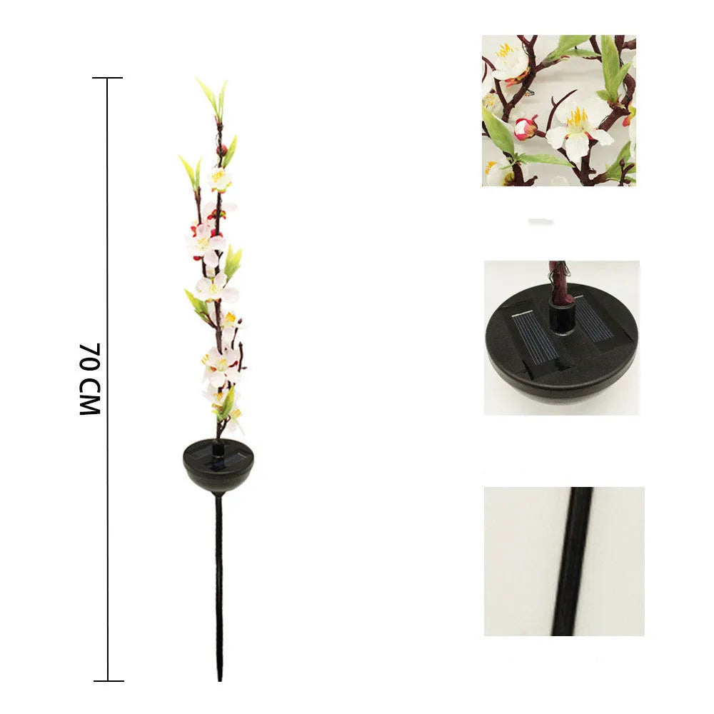 Solar-powered outdoor garden stake light with cherry blossom string LEDs and ground spike.