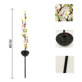 Solar-powered outdoor garden stake light with cherry blossom string LEDs and ground spike.