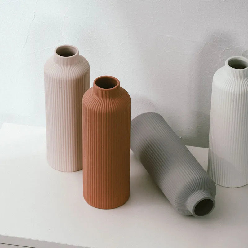 Ceramic vase in European style, grey colour, 22.7cm tall on a shelf