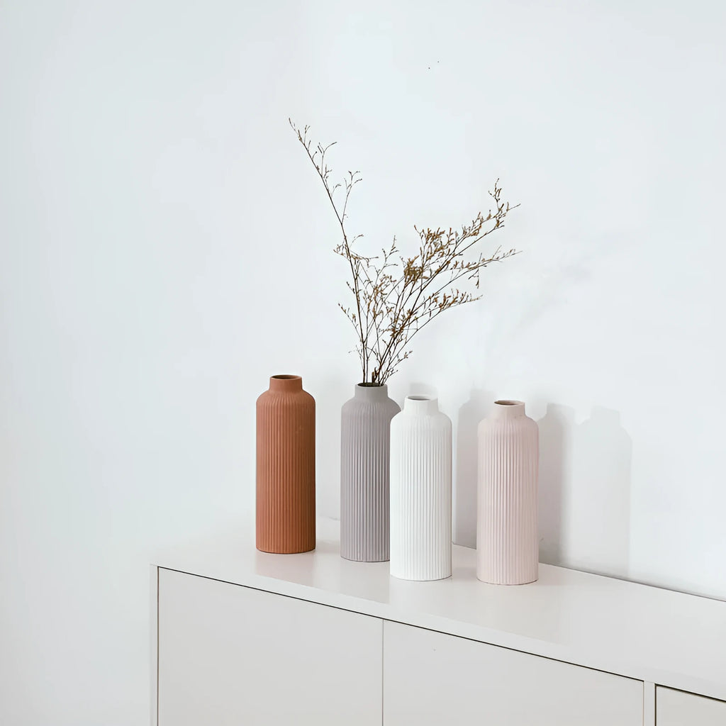 Ceramic vase in European style, grey colour, 22.7cm tall on a shelf