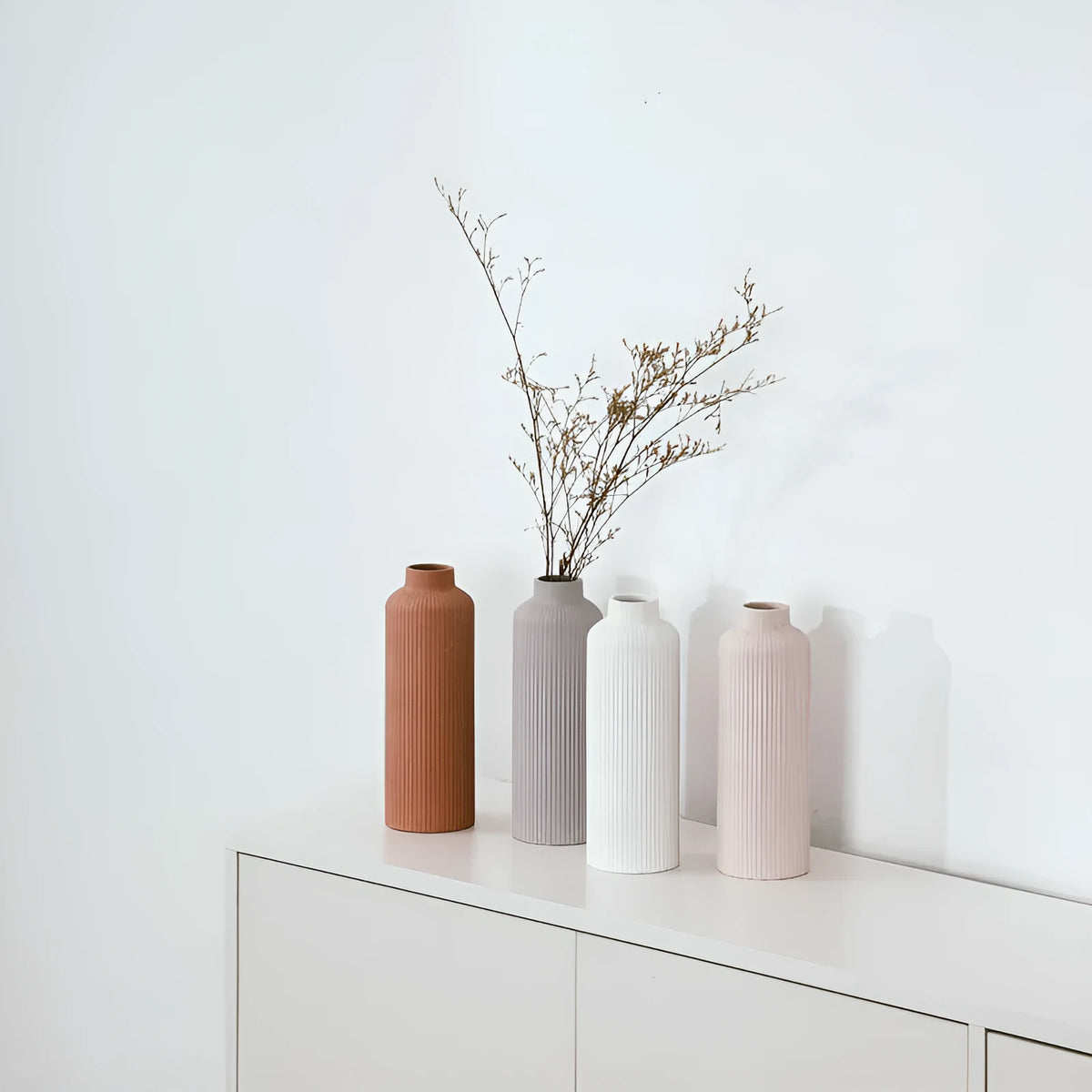 Ceramic vase in European style, grey colour, 22.7cm tall on a shelf