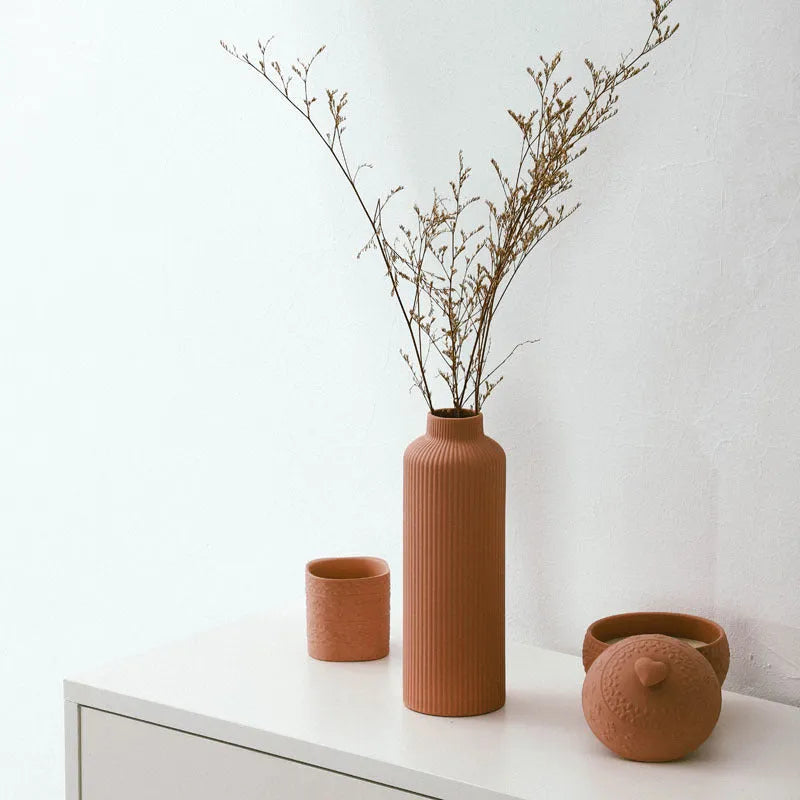 Ceramic vase in European style, grey colour, 22.7cm tall on a shelf
