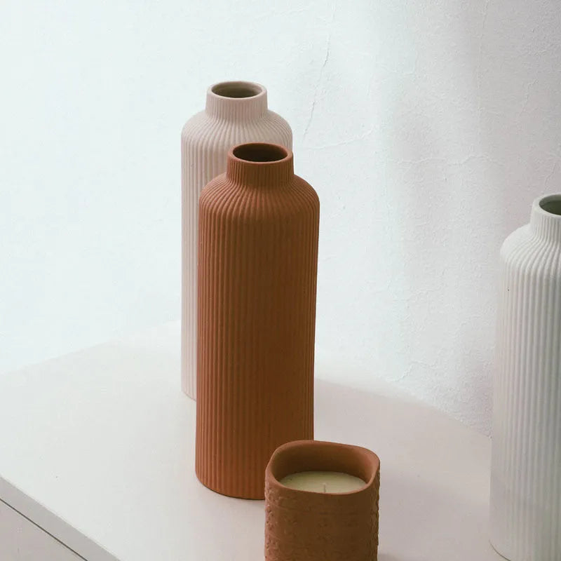 Ceramic vase in European style, grey colour, 22.7cm tall on a shelf