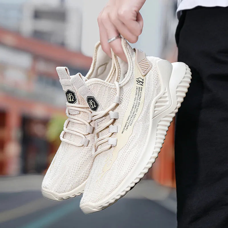 Men's white mesh sports shoes with rubber soles showing round toe and front-tie design