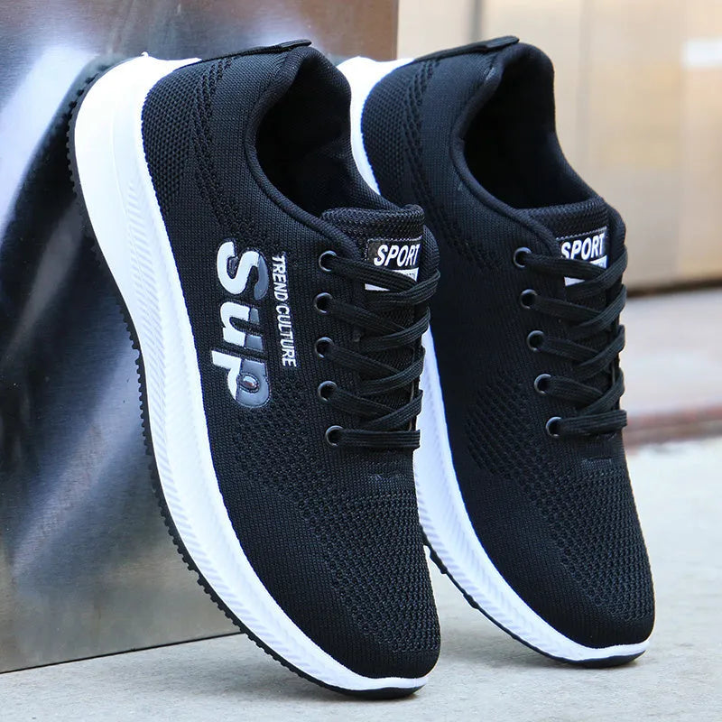 Men's breathable mesh casual sports shoes with black grey fabric upper rubber sole lace-up flat heel side view