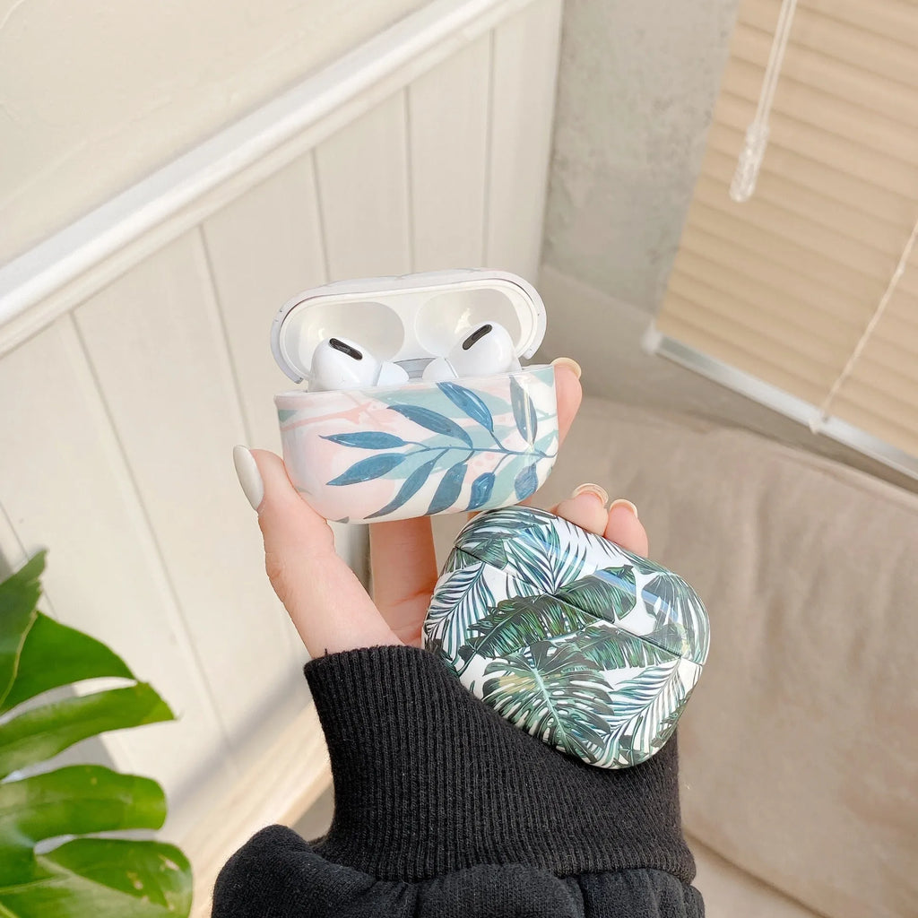 Blue TPU AirPods case with a painted tropical banana leaf design.