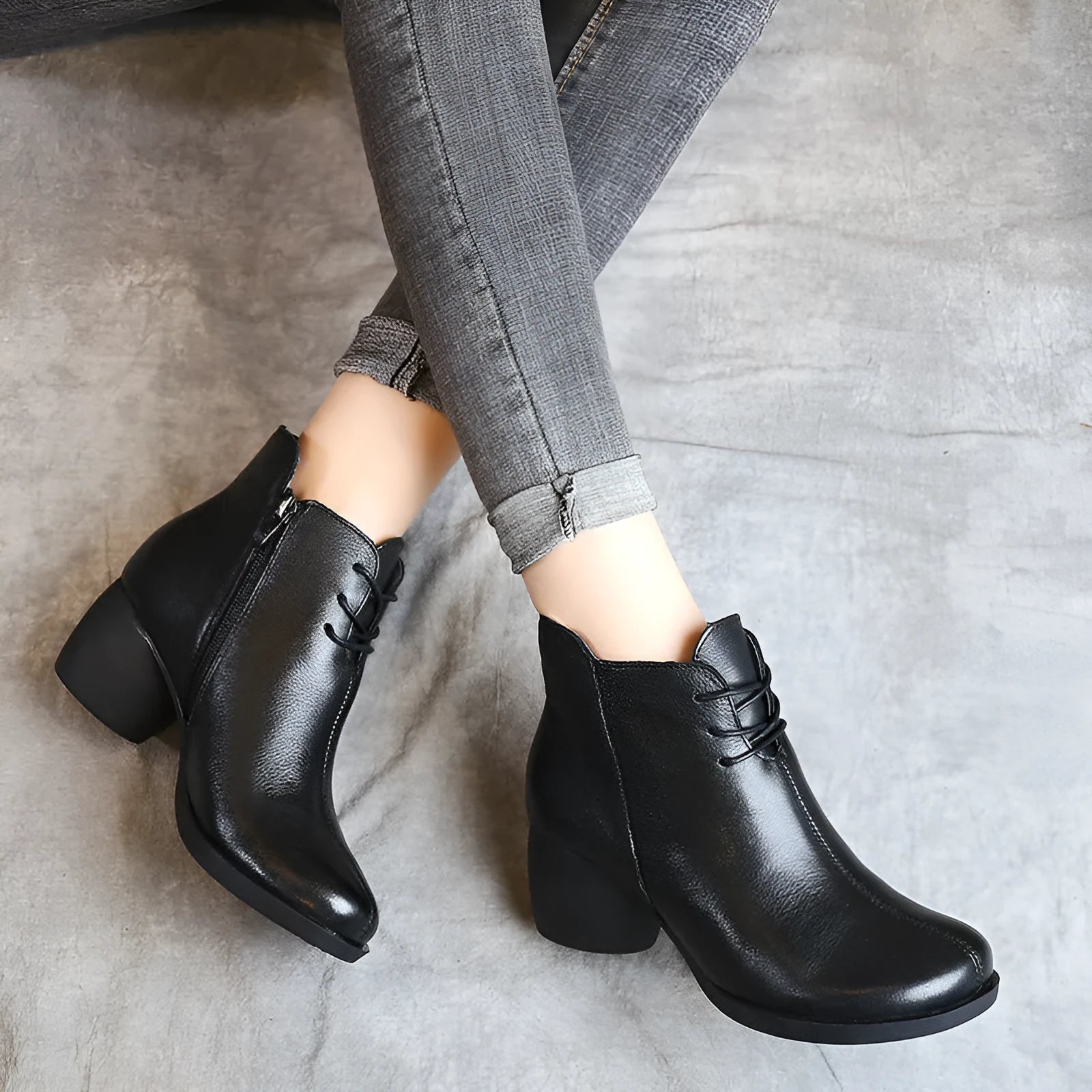 Women's brown leather Martin boots with a thick block heel and round toe.