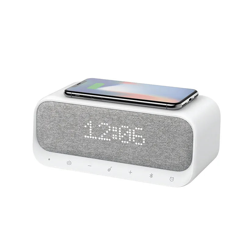 Anker Soundcore white or pink all-in-one Bluetooth speaker with wireless charging pad and digital display