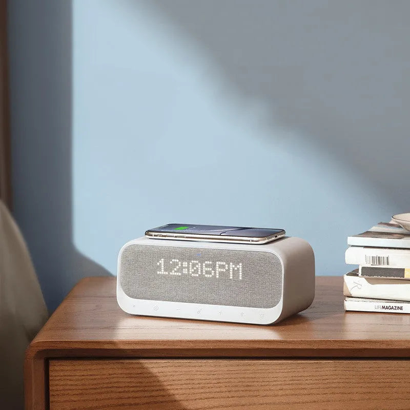 Anker Soundcore white or pink all-in-one Bluetooth speaker with wireless charging pad and digital display