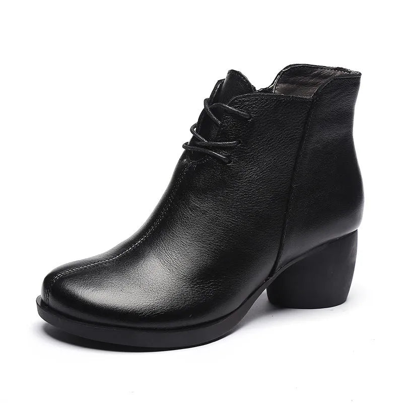 Women's brown leather Martin boots with a thick block heel and round toe.