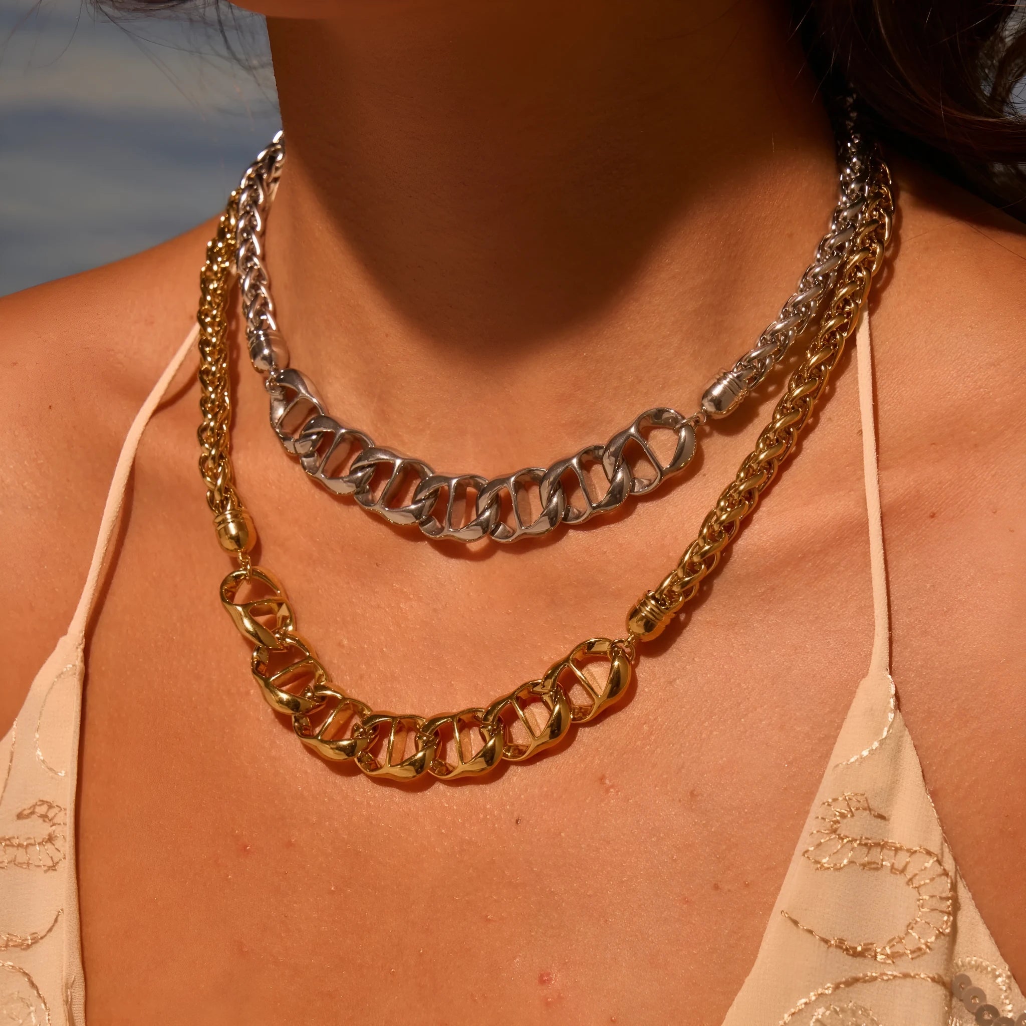 Women's stainless steel necklace with geometric pendant and gold plating on regular chain