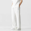 Men's light beige bamboo fibre straight-leg trousers with cropped length and drawstring waist on hanger
