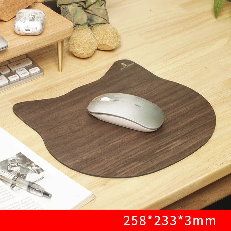 Extra large mouse pad with walnut wood surface and natural rubber base on a desk