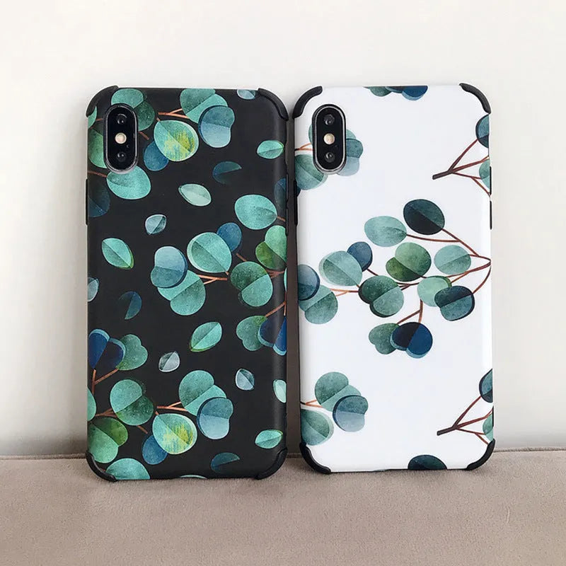 Black silicone iPhone case featuring a detailed leaf print design on the back.