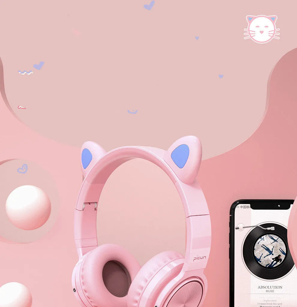 Pink and white Luminous wireless Bluetooth gaming headset with over-ear earcups and a braided cable.