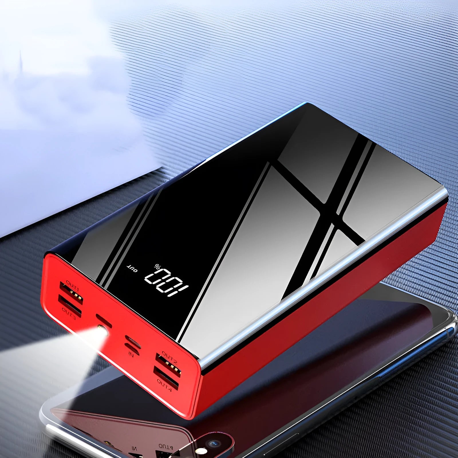 Red and black 40000mAh power bank with LCD display showing battery level.
