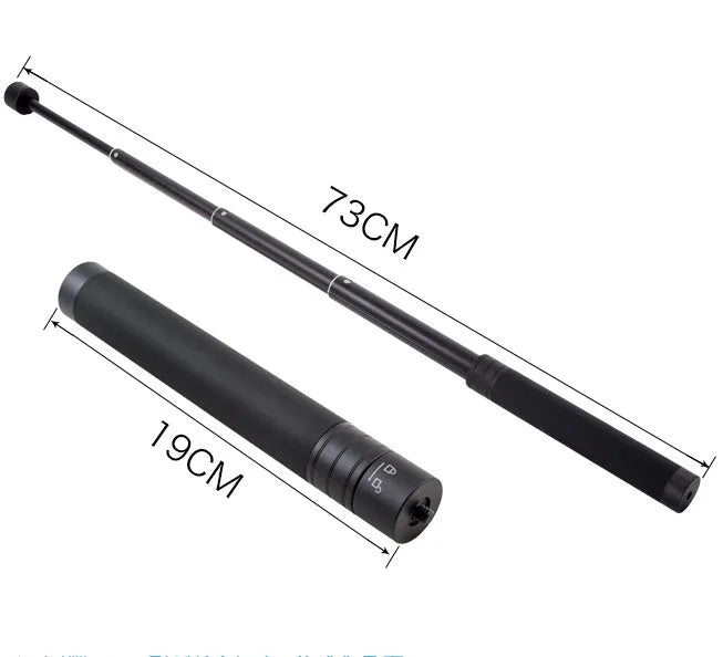 Black retractable selfie stick extended fully with phone attached, showing stabiliser grip.