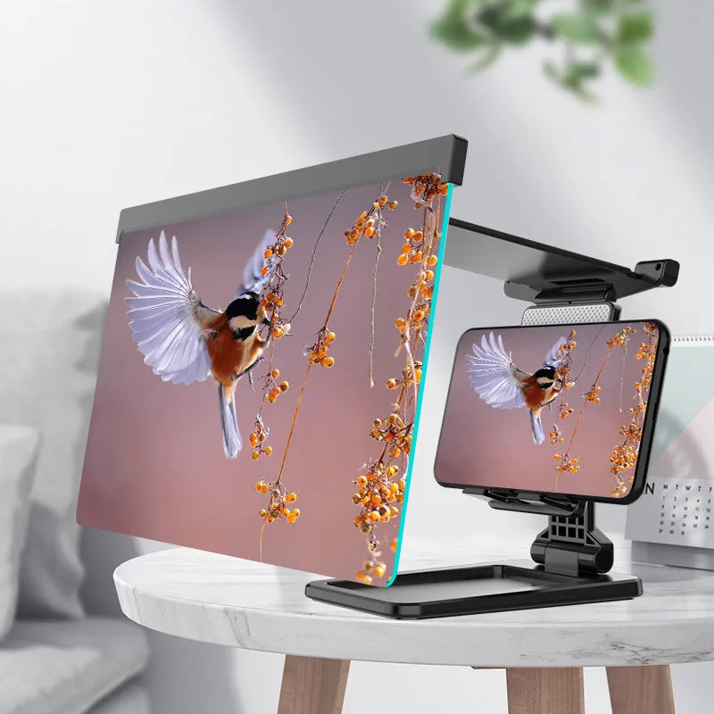 Black folding mobile phone screen amplifier with detachable holder on desktop