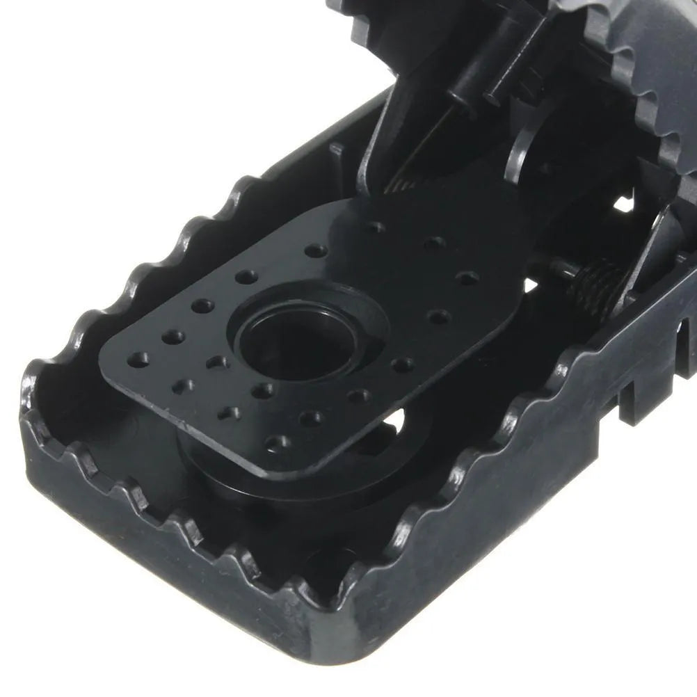 Six black snapping mousetraps with smooth plastic surface showing precise dimensions
