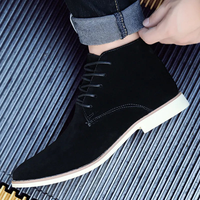 Large men's Martin boots in black with reverse suede vamp, pointed toe, front lacing, and thick heel