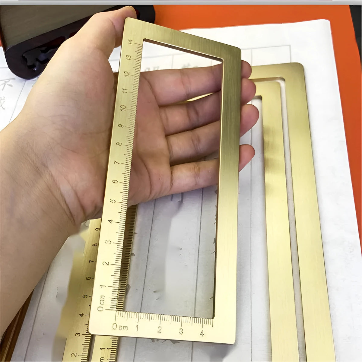 Solid brass calligraphy weight brush and paper scale with decorative carved designs