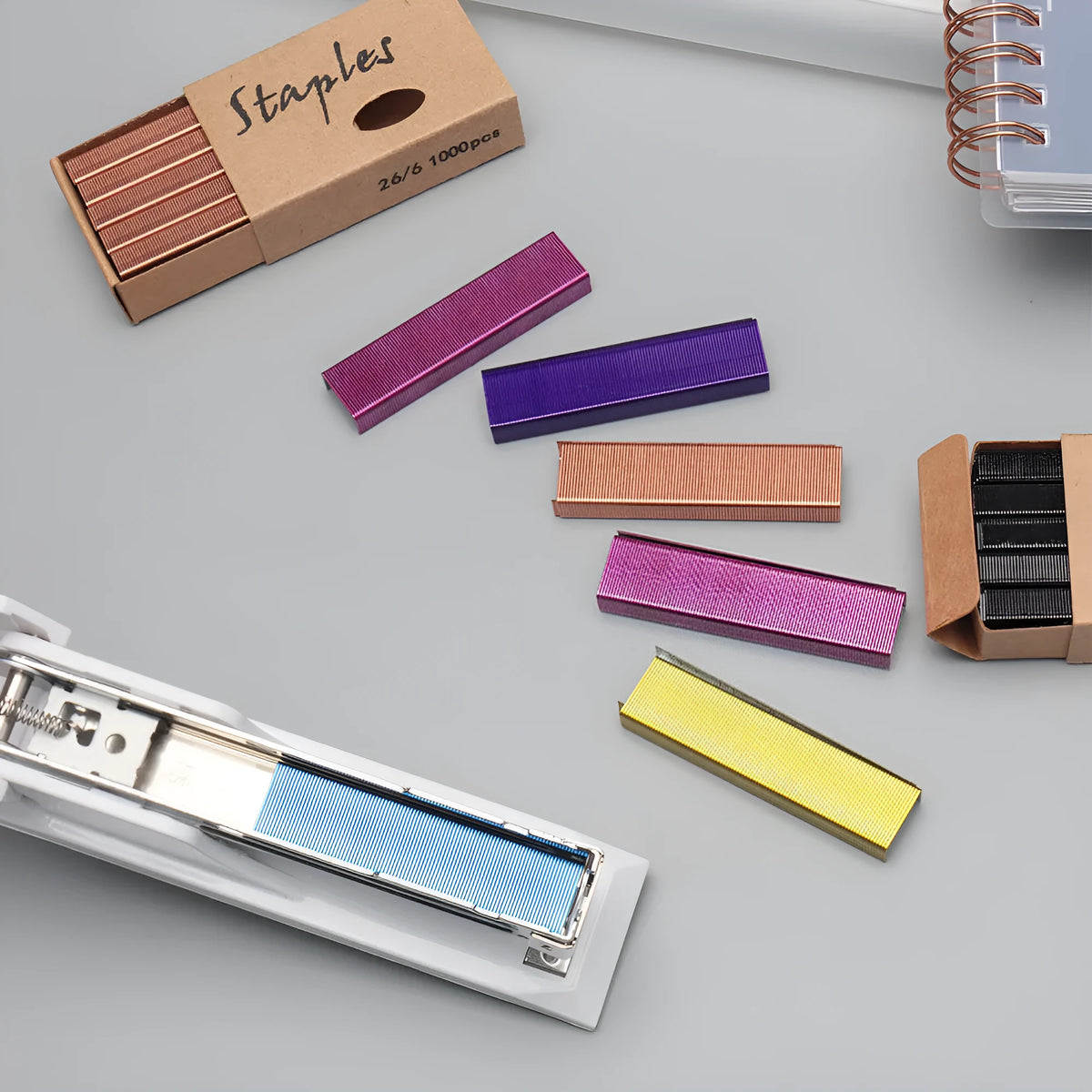 Box of 1000 metal stitching needle staples in four colour options: black, purple, rose gold and rose red