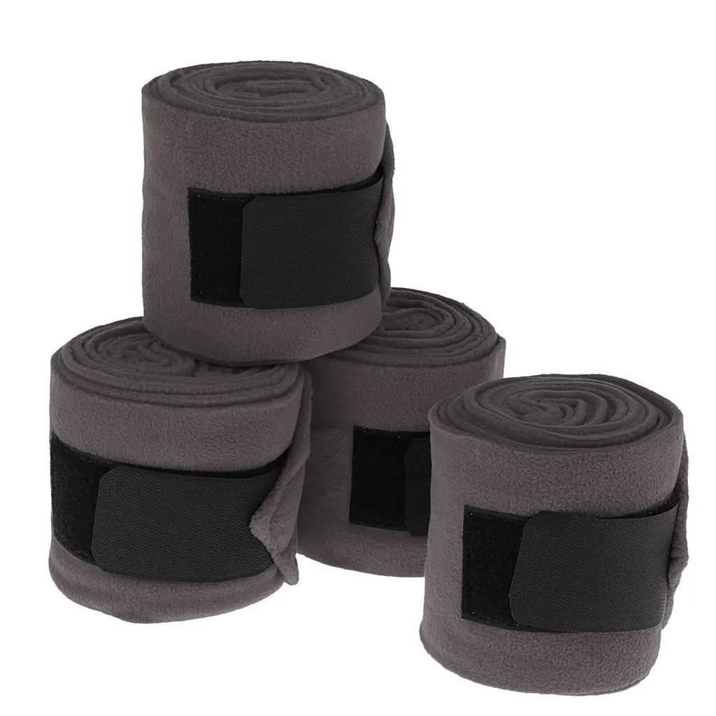 Set of 4 horse leg wraps in polar fleece, each 300cm x 11cm, with nylon sticky buckle, shown in Black, Blue, Grey, or Red