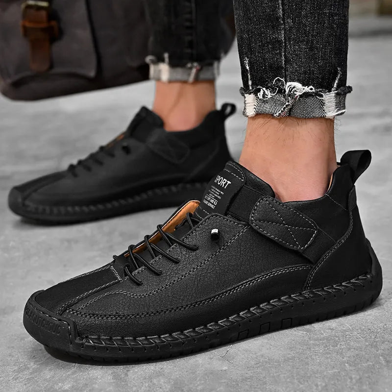 Men's mid-top Martin boots in multiple colours with elastic band and tooling stitching detail.