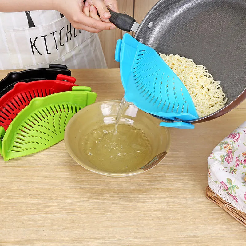 Silicone clip-on kitchen strainer with stainless steel mesh attached to cooking pot