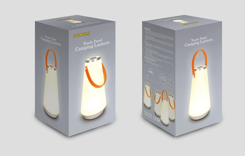 White rechargeable LED bedside lantern with USB cable on a table.