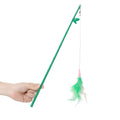 Green interactive cat feather wand toy with bells attached for indoor play and training