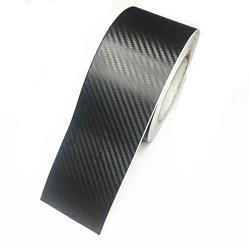 Close-up of matte black 3D carbon fibre pattern adhesive protection roll for car door sills