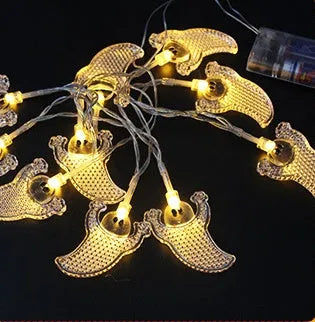 Halloween LED string lights with pumpkin, ghost and bat pendants on white cord