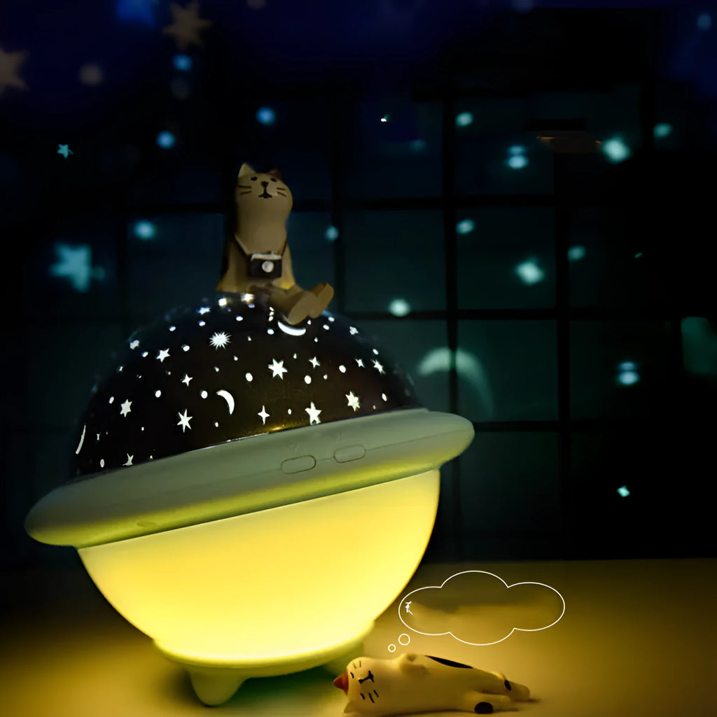 Green UFO-shaped starry sky projection light with button switch on a plastic base.