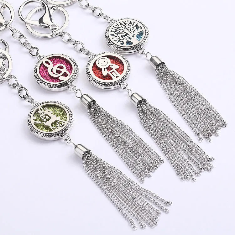 Silver alloy tassel car pendant on a chain with coloured scent cotton pads for essential oils.
