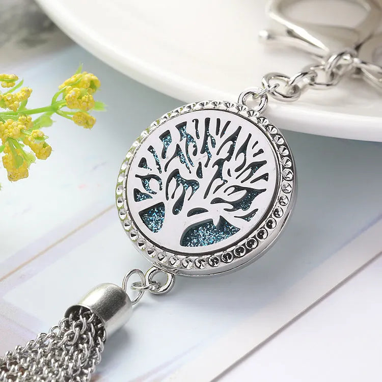Silver alloy tassel car pendant on a chain with coloured scent cotton pads for essential oils.