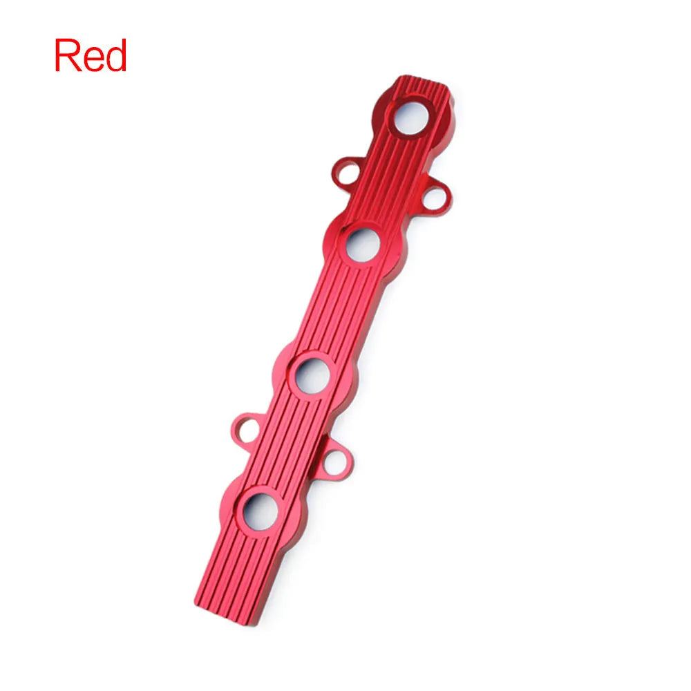 Aluminium alloy engine wiring harness housing cover in blue, red, and silver finishes.