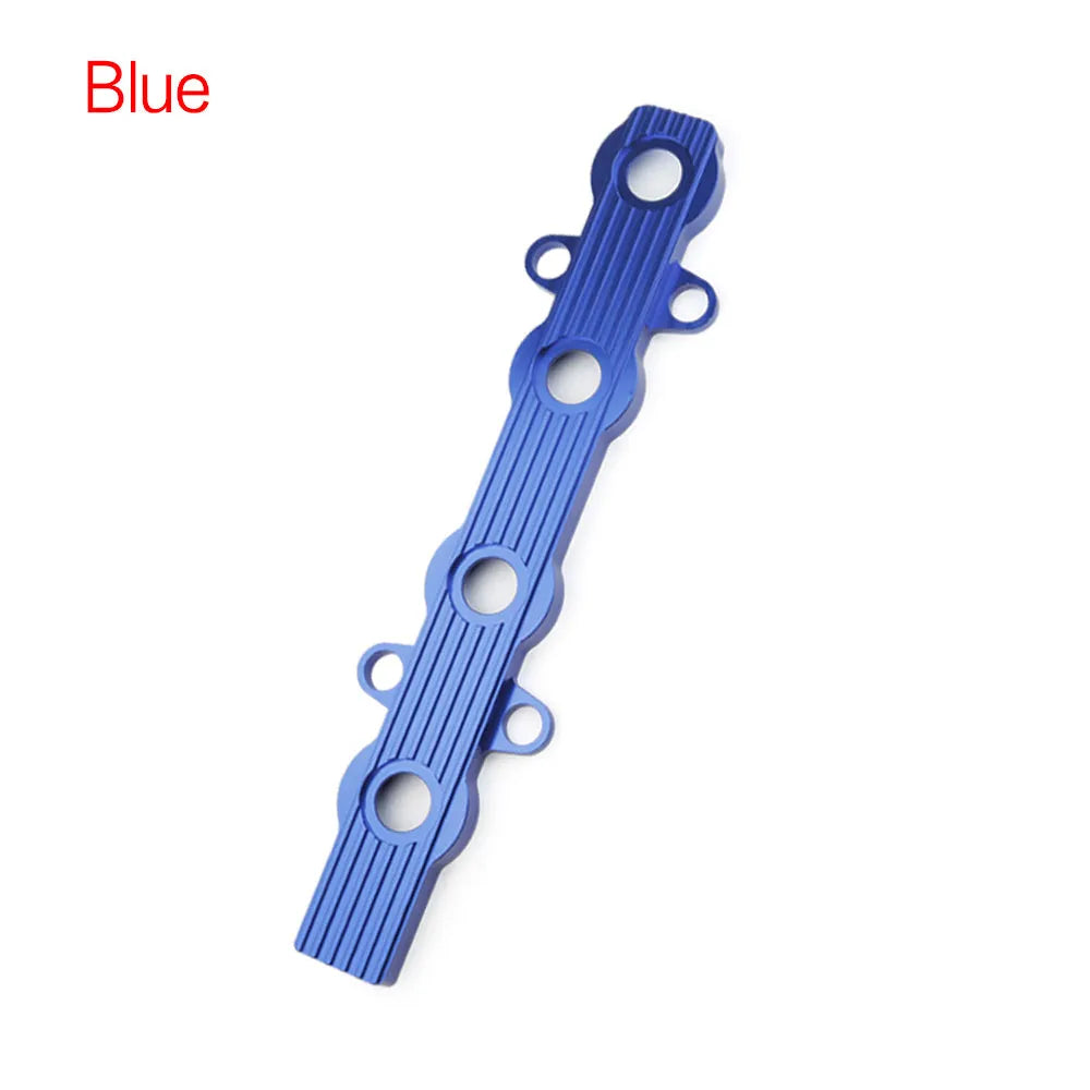 Aluminium alloy engine wiring harness housing cover in blue, red, and silver finishes.