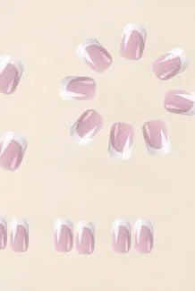 24 white square fake nails with a black and white plaid pattern arranged on a table.