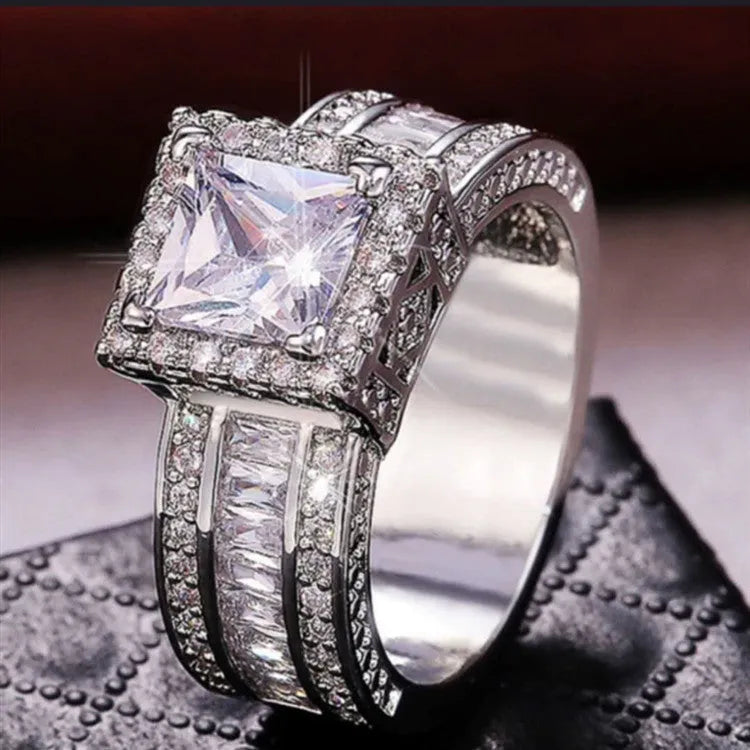 Alloy geometric women's ring with electroplated gold or white finish and round design elements
